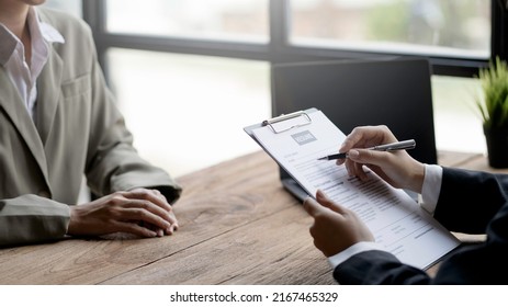 Close-up Of Business Owner Check Resume Of Job Applicants In Company At The Office.