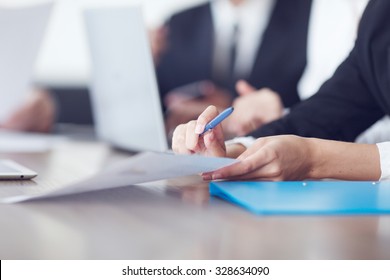 Close-up Of Business People Working Together At A Meeting