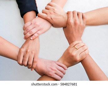 Close-up Of Business People's Hand Holding Each Other hand.Concept of Teamwork