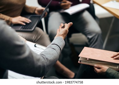 Close-up of business team having a meeting in the office. - Shutterstock ID 1983774758