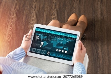 close-up business woman with computer tablet on lap