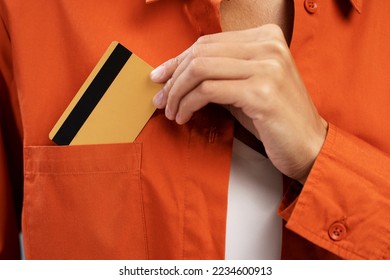 Closeup of business woman hand puts credit card in pocket. Shopping concept  - Shutterstock ID 2234600913