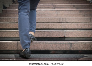 Closeup Business Woman Legs Walking Up A Stone Stairs.