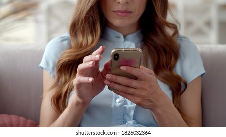 Closeup Business Woman Typing Message On Mobile Phone At Home Office. Young Girl Chatting On Phone In Slow Motion. Close Up Young Woman Hands Using Smartphone On Couch.