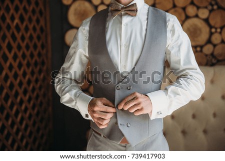 Similar – Man in suit wearing a bowtie