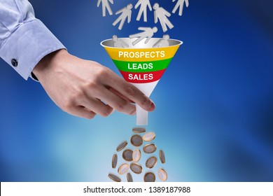 Close-up Of Businessman Holding Funnel Converting Prospects Into Money