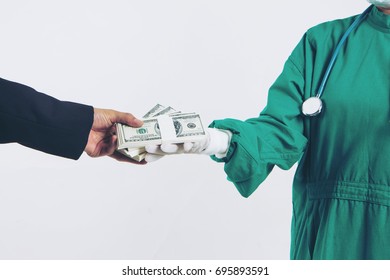 Closeup Businessman With Money Handshaking With Doctor