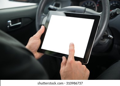 Close-up Of A Businessman Sitting In Car Holding Digital Tablet With Blank Screen - Powered by Shutterstock