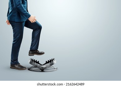 Close-up of a businessman's foot over a bear trap. The concept of problem solving, failure, crisis, crisis management, mixed media - Shutterstock ID 2162642489
