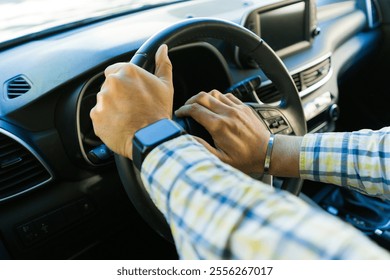 Close-up of businessman's hands holding steering wheel and honking the claxon while driving a modern car, - Powered by Shutterstock