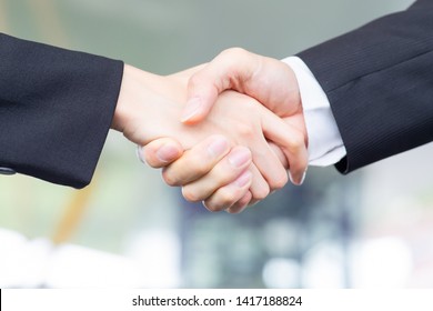 Closeup of Businesspeople shake hand after a meeting