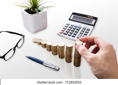 Close-up Of A Businessperson's Hand Stacking Coins In Office - Shutterstock ID 711852052