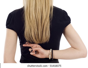 Closeup of a businesswoman with crossed fingers behind her back isolated over a white background - Powered by Shutterstock