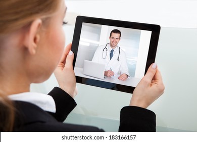 Close-up Of Businesswoman Having A Video Chat With Doctor