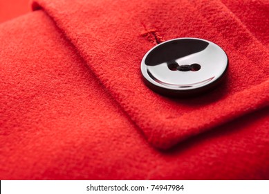 Close-up Of Button On Red Coat