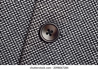 Closeup Of Button On Tweed Blazer