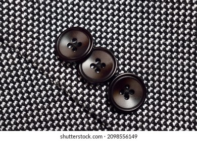 Closeup Of Button On Tweed Blazer