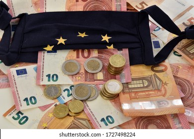 Die als Flagge der Europäischen Union konzipierte Nahaufnahme eines Taschenrechners, von Euro-Rechnungen und Tagesmasken, die das Konzept der Wirtschaft symbolisieren, wird durch die Epidemie mit dem Coronavirus verursacht.