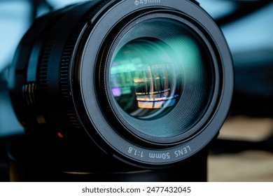 Close-up camera lens,Photo Camera or Video lens close-up on black background, objective, concept of photographer camera man job, looking for a photographer, 