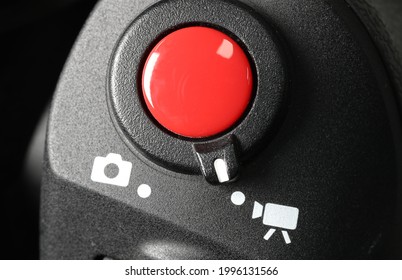 A close-up of the camera's record button.