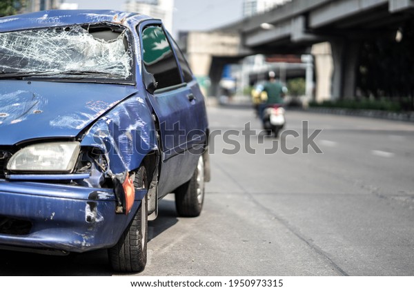 Closeup of car with broken windshield,\
damaged automobiles.