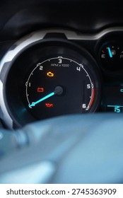 Close-up of a car dashboard with multiple warning lights illuminated, including check engine, battery, and oil pressure icons, signifying mechanical trouble.