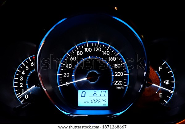 Close-up car dashboard with speedometer On\
the car dashboard, light up the car\
interior