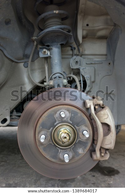 Closeup of car disc\
brake at car workshop