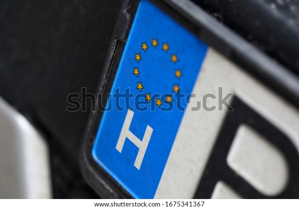 Close-up of car\
european license plate. Automobile from eu. Macro shot of\
registration number from european union. Small stars placed in\
circle. Vehicle and transport\
concept