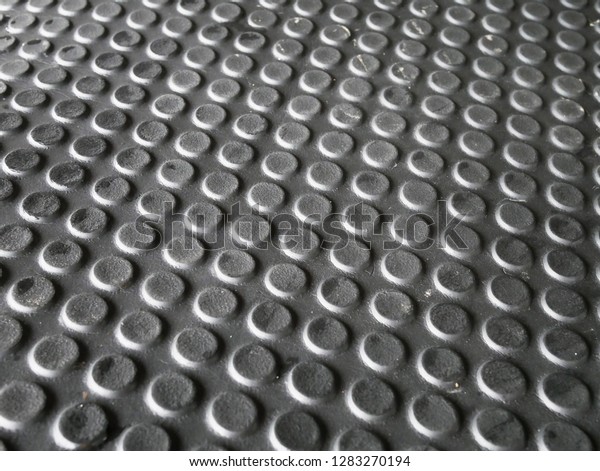closeup of car\
floor mats texture\
background.