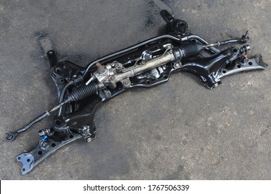 Close-up of Car front suspension and Hydraulic Power Steering Rack.  - Shutterstock ID 1767506339