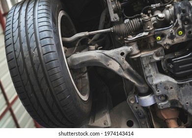 Close-up of car front suspension system components. - Shutterstock ID 1974143414