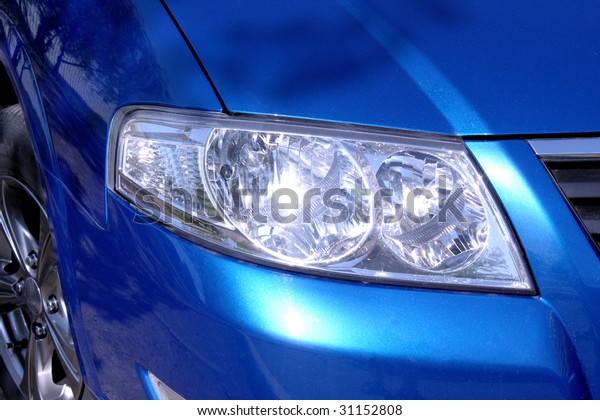 Close-up car headlight -\
horizontal photo
