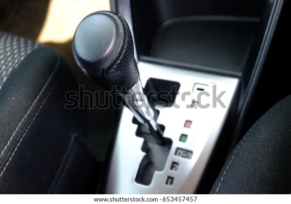 closeup car interior transmission, The\
mechanism of switching modes of automatic transmission car,\
Automatic gear car\
transmission.
