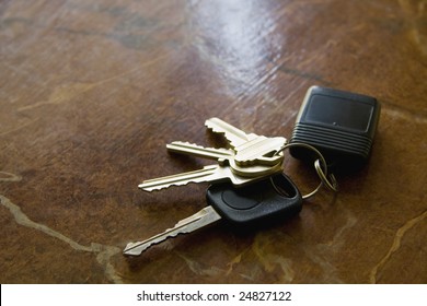 Close-up of car keys on a table.