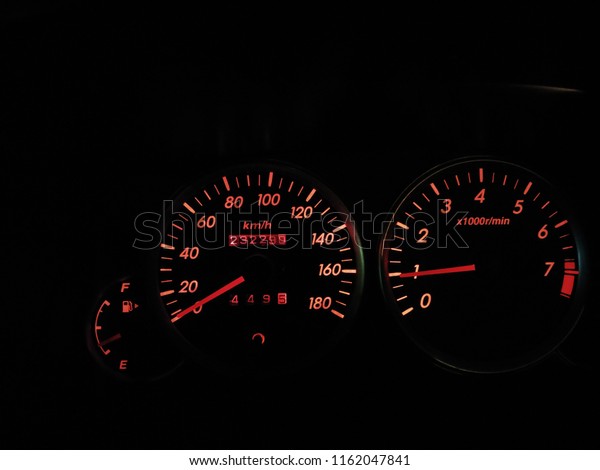 Closeup car meter in\
the dark background.
