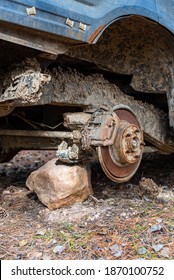 Close-up Car With Missing Wheels Stolen Car Wheel Pollution And Crime Problem Conversation Vintage Rusted Detail Discarded In Autumn Forest In Bulgaria, Eastern Europe