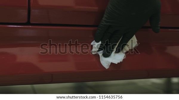 closeup of car paint degreasing with alcohol\
before polishing