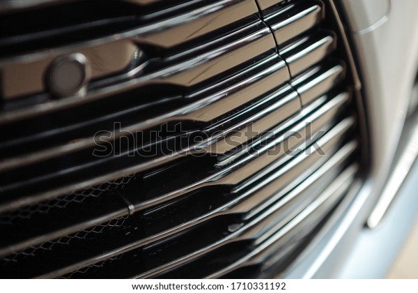Closeup of a car\
radiator grill. car\
dealership