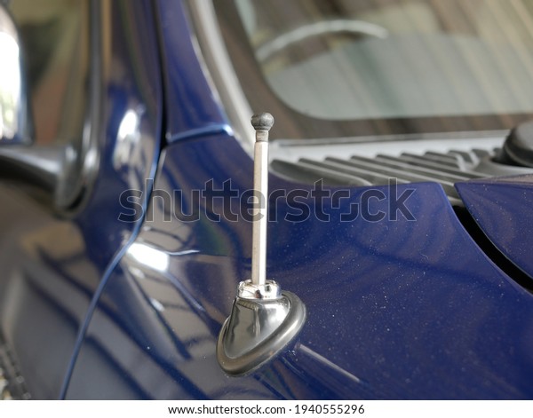 closeup of car radio AM FM\
antenna.