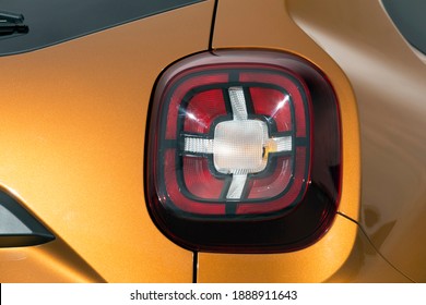 Close-up car rear tail-lamp with a tail light stop signal.