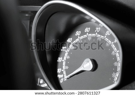 Close-up of car speedometer showing zero mph