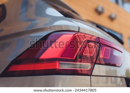 Closeup of car tail light on a white car
