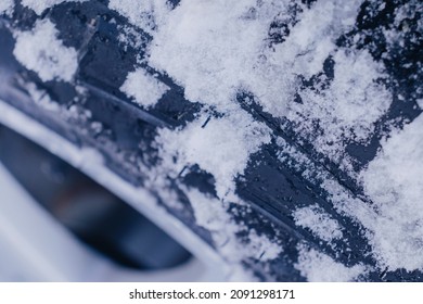 Close-up Of A Car Tire Covered With Snow. Concept Of Winter Travelling, Safety On The Roads, Extreme Driving. Copy Space.