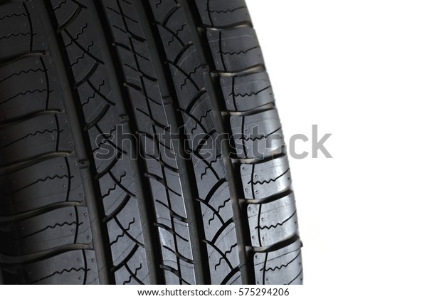 Close-up car tire isoleated on white\
background, concept of tire\
warehouse.