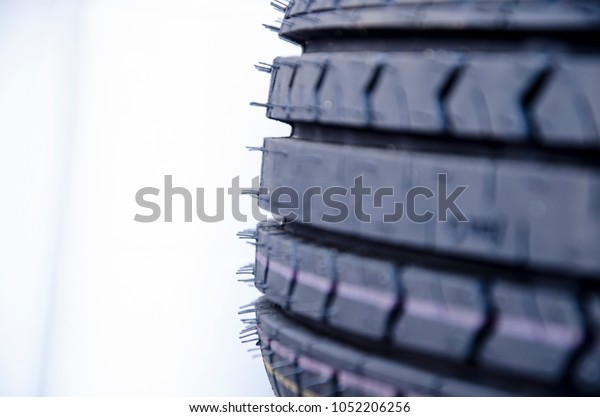 \
Closeup\
of car tire texture with white negative\
space