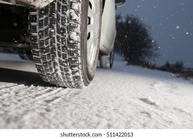 Closeup of car tires in winter. the first snow in late autumn