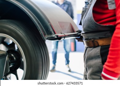 Closeup Of Car Wheel Balancing In Tire Service