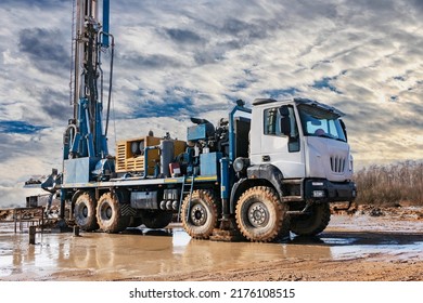 Close-up of a car-based drilling rig at a construction site. Drilling deep wells for mining.. Working process of drilling a well