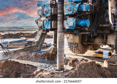 Close-up of a car-based drilling rig at a construction site. Drilling deep wells for mining.. Working process of drilling a well - Shutterstock ID 2176666057